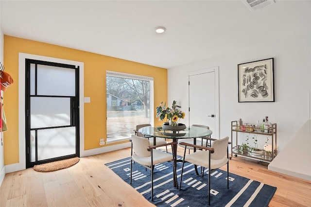 dining space featuring light hardwood / wood-style flooring