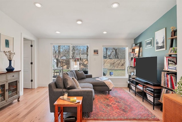 living room with plenty of natural light and light wood-type flooring