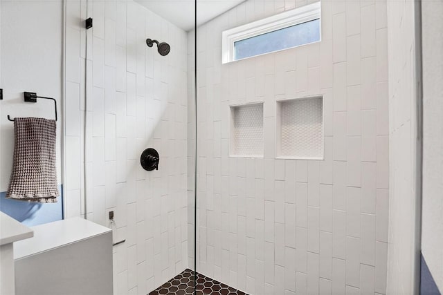 bathroom featuring tiled shower