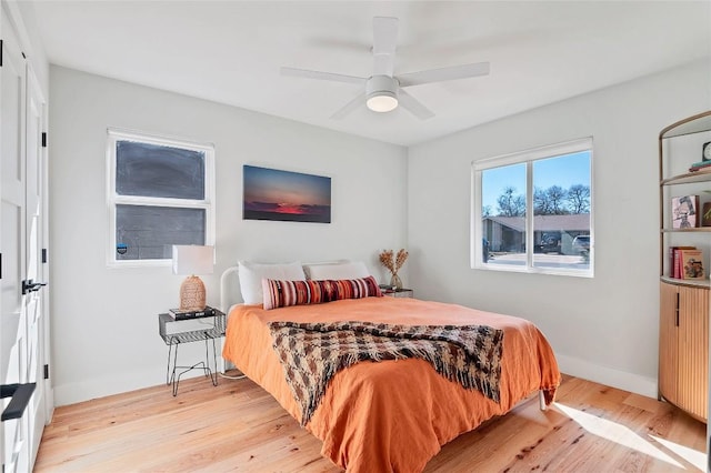 bedroom featuring ceiling fan and light wood-type flooring