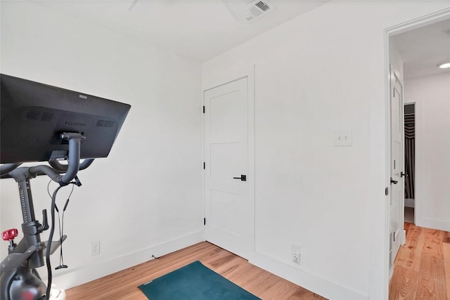 exercise area with light hardwood / wood-style floors