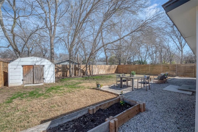 view of yard with a storage unit and a patio