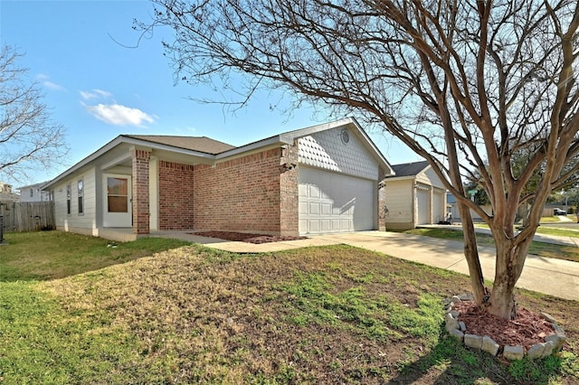 7405 Cayenne Ln, Austin, TX 78741 - view of property exterior with brick siding, concrete driveway, and a garage