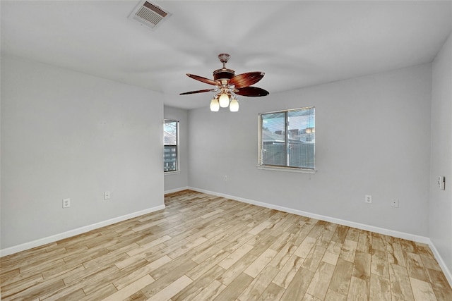 unfurnished room featuring ceiling fan and light hardwood / wood-style flooring