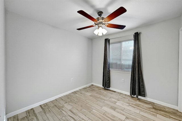 empty room featuring ceiling fan and light hardwood / wood-style floors