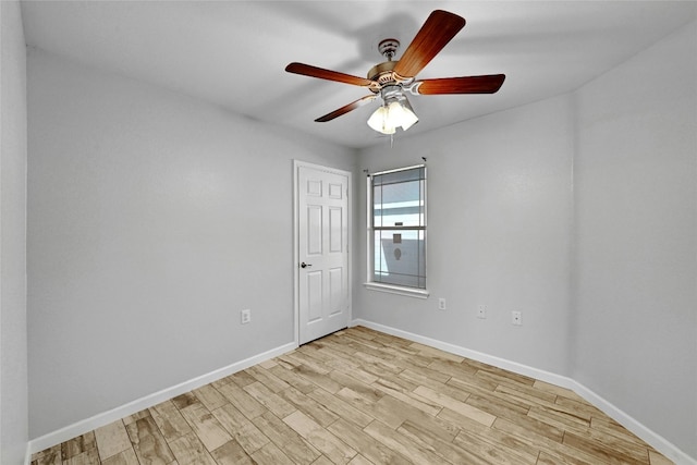 unfurnished room featuring light hardwood / wood-style flooring and ceiling fan