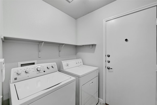 laundry room with washing machine and dryer