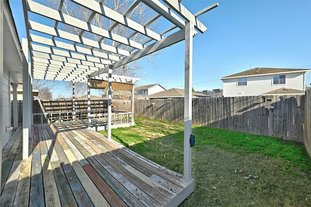 deck featuring a yard and a pergola