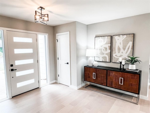 foyer entrance with light hardwood / wood-style floors