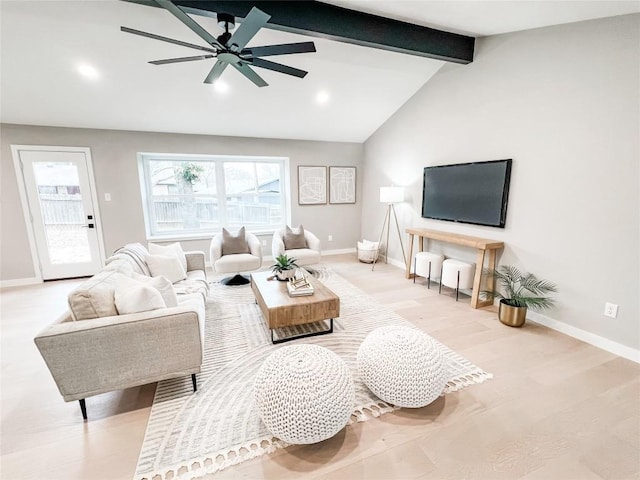 living room with vaulted ceiling with beams, light hardwood / wood-style floors, and ceiling fan