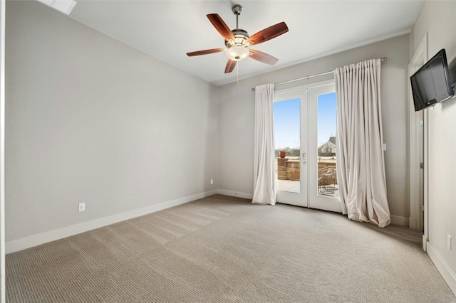 unfurnished room with french doors, ceiling fan, and light carpet