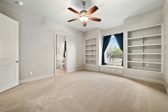 spare room with light carpet and ceiling fan