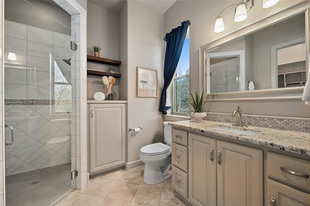 bathroom with vanity, toilet, and walk in shower