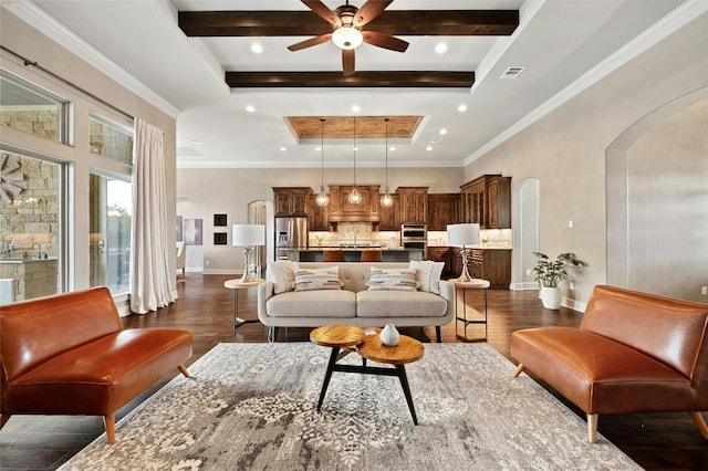 living room featuring crown molding, ceiling fan, beam ceiling, a tray ceiling, and dark hardwood / wood-style flooring