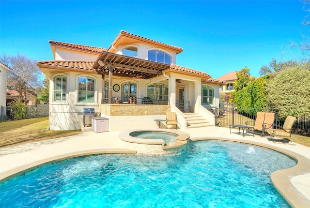 rear view of property with a tile roof, a patio, and fence