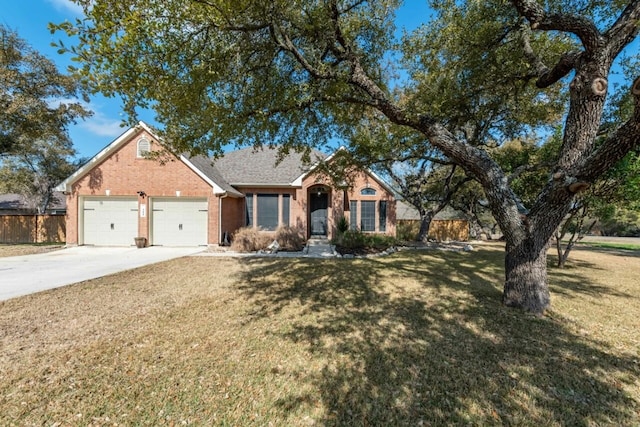 view of front of property with a garage and a front lawn