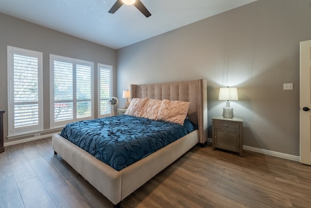 bedroom featuring dark hardwood / wood-style floors and ceiling fan