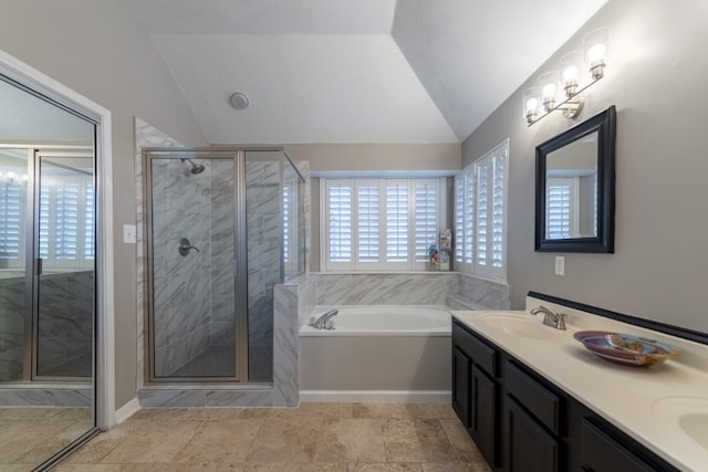 bathroom with vanity, vaulted ceiling, a healthy amount of sunlight, and separate shower and tub