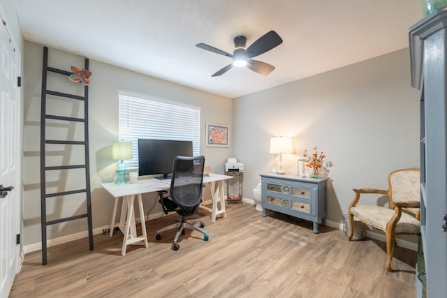 office area with light hardwood / wood-style floors and ceiling fan