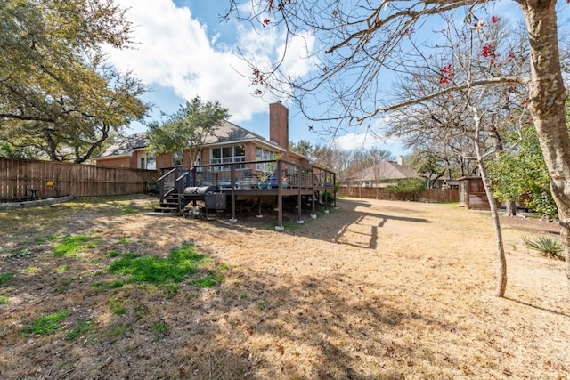 back of house with a wooden deck