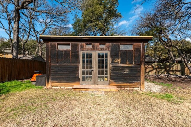 view of outbuilding featuring a lawn