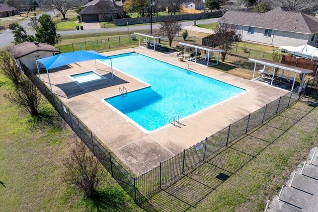 view of pool featuring a community hot tub and a patio