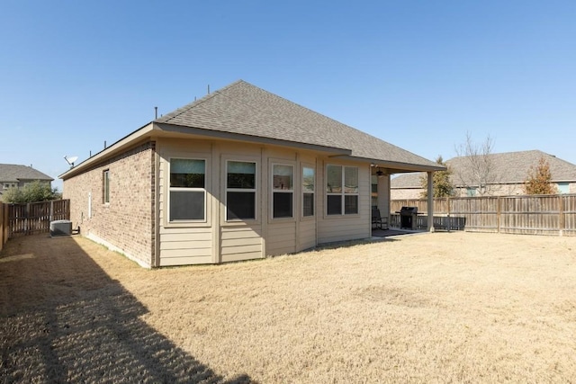 rear view of property featuring central air condition unit