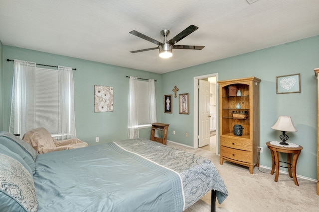 bedroom with light colored carpet and ceiling fan