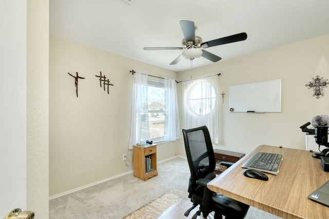 home office featuring ceiling fan and carpet