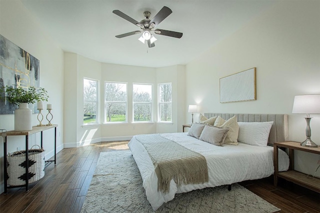 bedroom featuring ceiling fan and dark hardwood / wood-style flooring