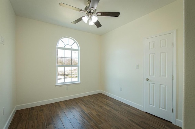 unfurnished room featuring ceiling fan and dark hardwood / wood-style flooring