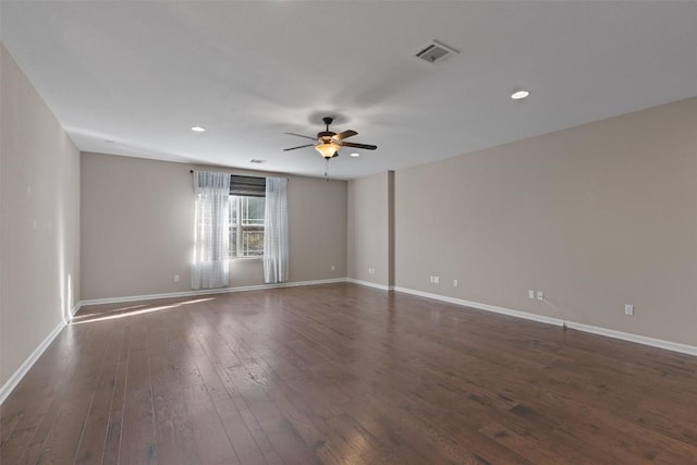 unfurnished room with dark hardwood / wood-style floors and ceiling fan