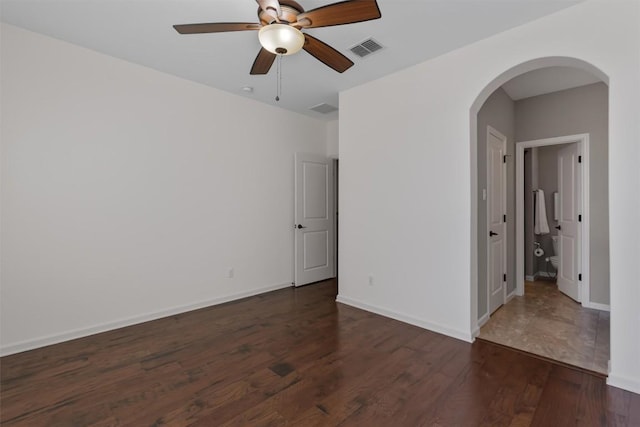 unfurnished room featuring ceiling fan and dark hardwood / wood-style floors