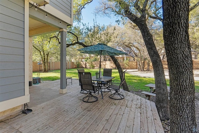 wooden deck featuring a yard