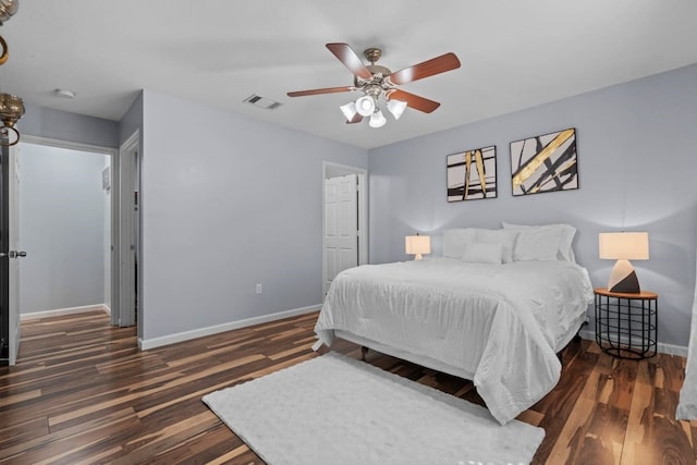 bedroom featuring ceiling fan and dark hardwood / wood-style flooring