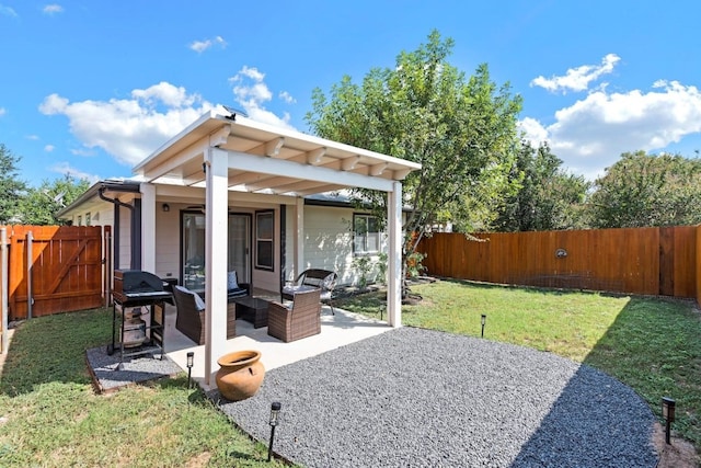 back of property with an outdoor living space, a yard, and a patio area