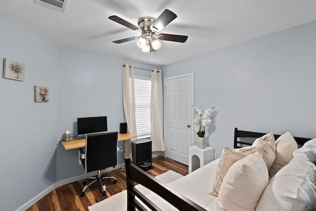 bedroom featuring dark wood-type flooring and ceiling fan