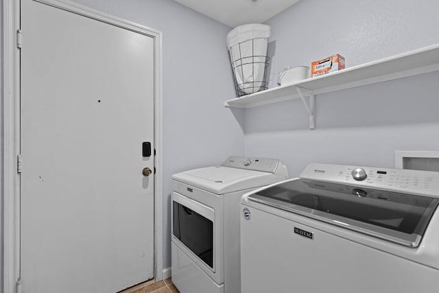 laundry room with separate washer and dryer