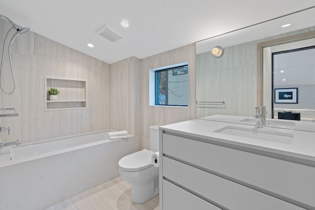 full bathroom featuring vanity, washtub / shower combination, and toilet