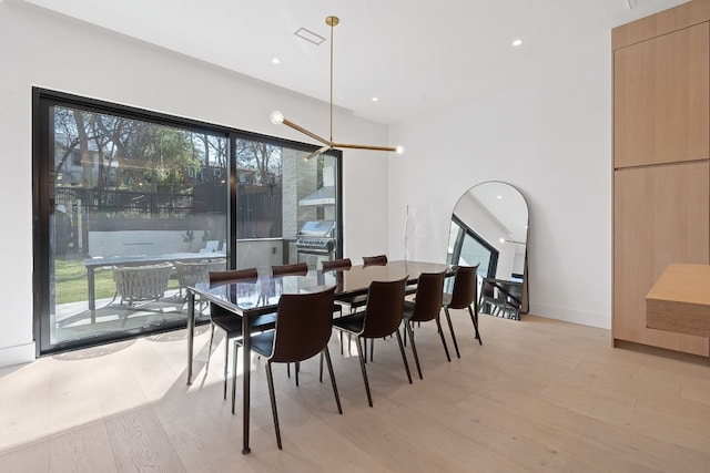 dining space featuring light hardwood / wood-style floors