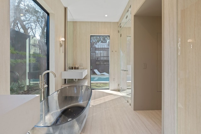 kitchen featuring sink, light brown cabinets, and light tile patterned floors