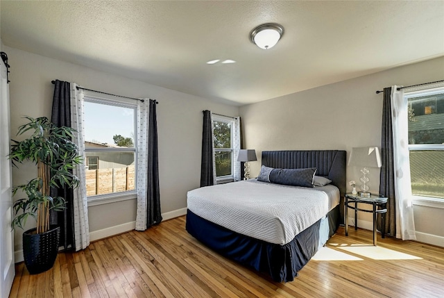 bedroom with light hardwood / wood-style flooring