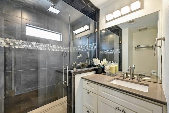 bathroom featuring vanity and an enclosed shower