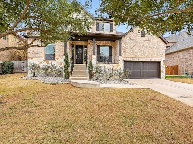 view of front facade featuring a garage, a front yard, and covered porch