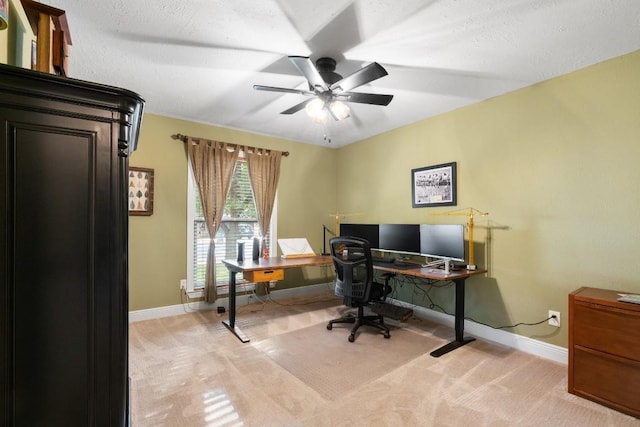 home office with light carpet and ceiling fan