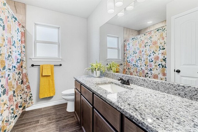 2651 Cowgirl Trl, Belton, TX 76513 - bathroom with vanity, toilet, baseboards, wood finished floors, and a shower with shower curtain