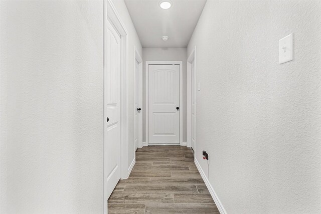 2651 Cowgirl Trl, Belton, TX 76513 - hallway featuring wood finished floors and baseboards