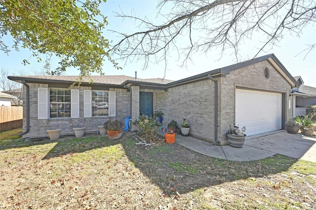 single story home with a garage and a front lawn