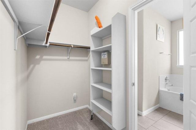 spacious closet with light tile patterned flooring