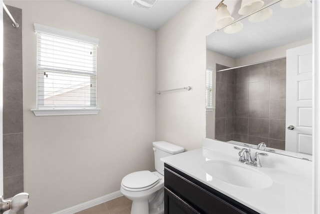 full bathroom featuring vanity, a healthy amount of sunlight, tile patterned flooring, and walk in shower